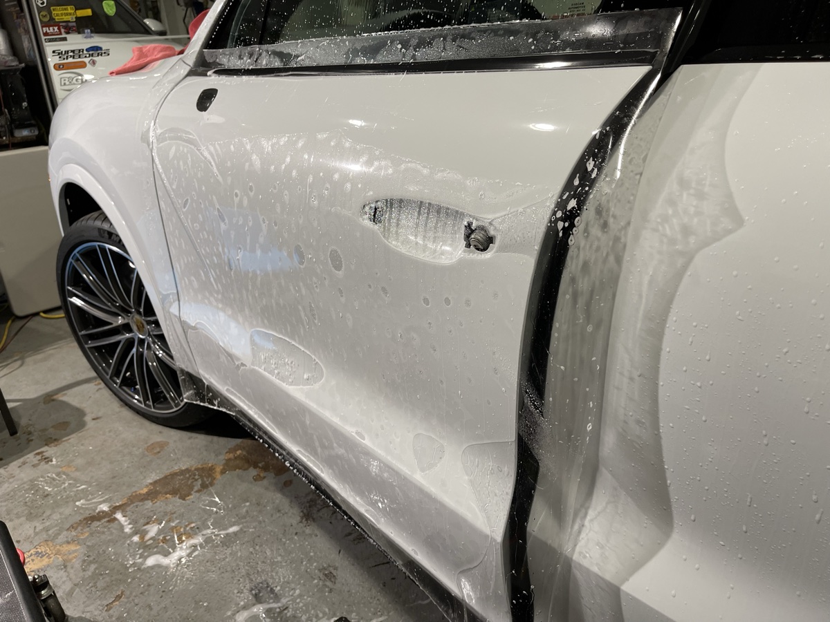 LLumar Valor PPF installation on white Porsche Cayenne door panel at CBA Detailing Bergen County NJ