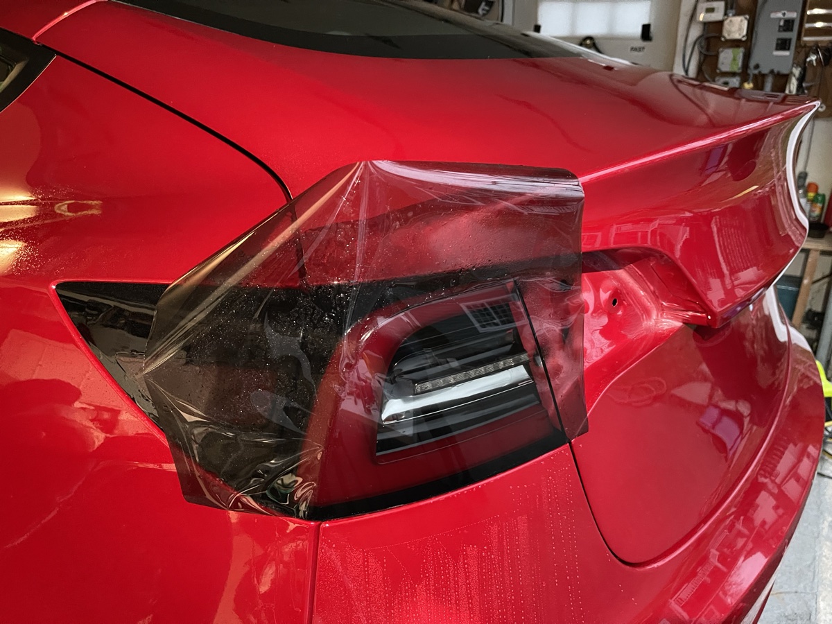 Close-up of LLumar Valor PPF protecting Tesla taillight at CBA Detailing NJ